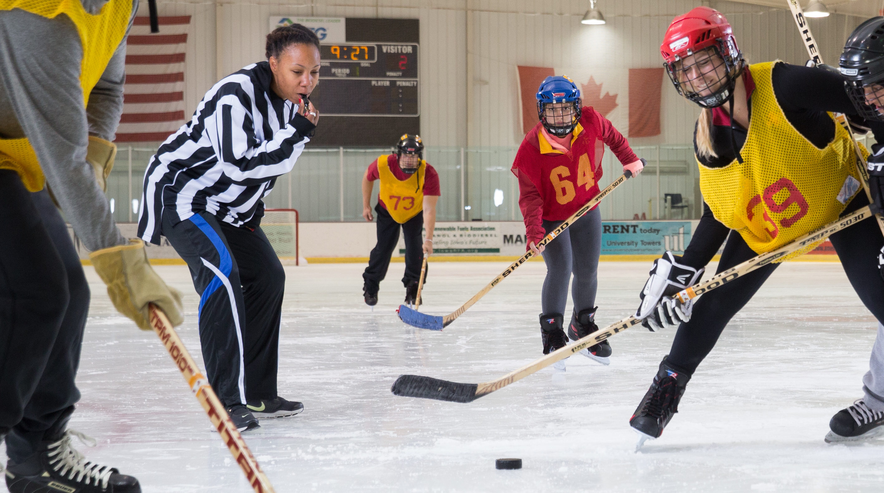 Students playing ice hockey