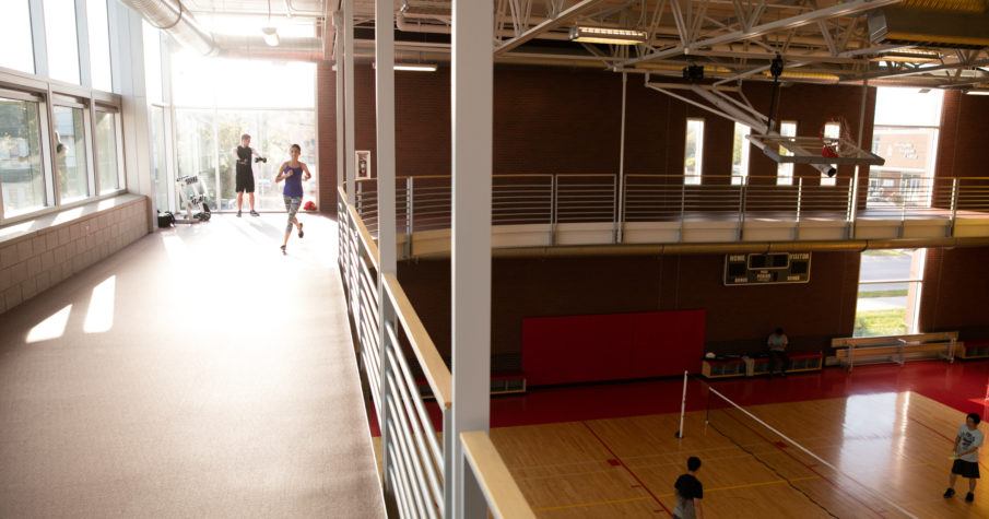 Students running on the indoor track